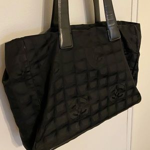 Used.  Chanel Black Nylon Handbag